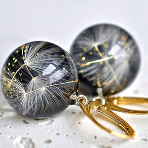 Black resin  gold plated  earings with dandelions short hoop.